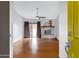 Bright living room with a stone fireplace, a ceiling fan, and a sliding glass door at 3106 S Extension Rd, Mesa, AZ 85210