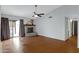 Living room features wood floors, a fireplace, and sliding door access to the outside at 3106 S Extension Rd, Mesa, AZ 85210