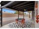 Covered patio with decorative lighting, outdoor seating, and a view of the private backyard at 3106 S Extension Rd, Mesa, AZ 85210