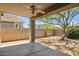 Covered patio overlooking the walled backyard offers a tranquil desert setting with mature landscaping and shade at 35314 N 31St Ave, Phoenix, AZ 85086