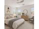 Bright bedroom with modern ceiling fan, stylish decor, and natural light from large windows at 35314 N 31St Ave, Phoenix, AZ 85086