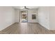 Bright living room with new wood floors, blinds, and a sliding glass door to the backyard at 35314 N 31St Ave, Phoenix, AZ 85086