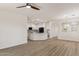 Open-concept living area with wood-look floors connecting to a modern kitchen, with ample space for entertaining at 35314 N 31St Ave, Phoenix, AZ 85086