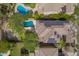 Overhead view showcasing homes with solar panels, swimming pools, and meticulously landscaped yards in a residential community at 3818 E Quail Ave, Phoenix, AZ 85050