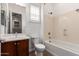 A bathroom with vanity sink, tiled floor, toilet and bathtub with shower at 3818 E Quail Ave, Phoenix, AZ 85050