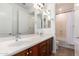 Bathroom with double sinks and vanity with bathtub and shower at 3818 E Quail Ave, Phoenix, AZ 85050