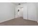 Bedroom with neutral carpet with open door at 3818 E Quail Ave, Phoenix, AZ 85050