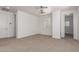 Neutral carpeted room with shutters and lots of open doorways at 3818 E Quail Ave, Phoenix, AZ 85050