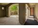 Covered courtyard offering shaded space with elegant columns and views of the well-manicured surroundings at 3818 E Quail Ave, Phoenix, AZ 85050