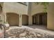 Tranquil courtyard featuring arched entryways, decorative lighting, and a serene atmosphere at 3818 E Quail Ave, Phoenix, AZ 85050