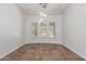 Bright dining room with tiled floors, plantation shutters, and an elegant chandelier at 3818 E Quail Ave, Phoenix, AZ 85050