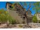 Attractive two-story home with stone accents and a well-manicured yard, exuding curb appeal at 3818 E Quail Ave, Phoenix, AZ 85050