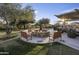 Outdoor fire pit with seating, perfect for gatherings in a tranquil, landscaped setting at 3818 E Quail Ave, Phoenix, AZ 85050