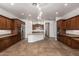 Expansive kitchen area with ample counter space and direct access to a second room at 3818 E Quail Ave, Phoenix, AZ 85050