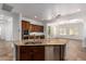 Stylish kitchen featuring granite counters, stainless appliances, and an island at 3818 E Quail Ave, Phoenix, AZ 85050