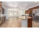 Gourmet kitchen with granite countertops, stainless steel appliances, and island at 3818 E Quail Ave, Phoenix, AZ 85050