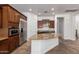 Beautiful kitchen showcasing stainless steel appliances, granite island, and custom cabinetry at 3818 E Quail Ave, Phoenix, AZ 85050