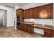Gourmet kitchen featuring built-in double ovens, and granite countertops at 3818 E Quail Ave, Phoenix, AZ 85050