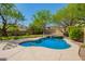 Sparkling backyard pool with lush landscaping and a serene setting, perfect for relaxation and entertainment at 3818 E Quail Ave, Phoenix, AZ 85050