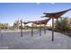 Community pool area featuring shaded seating and lounge chairs, perfect for relaxation at 3818 E Quail Ave, Phoenix, AZ 85050