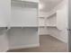 Walk-in closet featuring custom shelving and ample storage space at 3818 E Quail Ave, Phoenix, AZ 85050