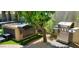 Backyard featuring a hot tub, grill, and lush landscaping creating a private oasis at 4617 E Emile Zola Ave, Phoenix, AZ 85032