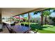 Backyard with outdoor dining, a pool, putting green, and lush landscaping for ultimate entertainment at 4617 E Emile Zola Ave, Phoenix, AZ 85032