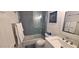 Bathroom featuring a tiled shower with glass door, neutral paint, and modern fixtures at 4617 E Emile Zola Ave, Phoenix, AZ 85032
