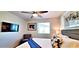 Bedroom features a TV, ceiling fan, artwork, and large window at 4617 E Emile Zola Ave, Phoenix, AZ 85032