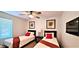 Bright bedroom showcases two twin beds, ceiling fan, neutral paint, and window at 4617 E Emile Zola Ave, Phoenix, AZ 85032