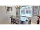 Bright dining room with chandelier, overlooking the pool through large windows at 4617 E Emile Zola Ave, Phoenix, AZ 85032
