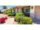 Front entrance showcasing stone accents, a desert landscape, and a walkway to the front door at 4617 E Emile Zola Ave, Phoenix, AZ 85032
