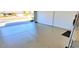 Clean garage featuring epoxy flooring, great lighting and plenty of space for parking and storage at 4617 E Emile Zola Ave, Phoenix, AZ 85032