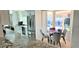 Bright kitchen with stainless steel appliances and an eat-in dining space with pool views at 4617 E Emile Zola Ave, Phoenix, AZ 85032