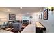 Open-concept living room boasting sleek furnishings, a shuffleboard table, and stylish decor at 4617 E Emile Zola Ave, Phoenix, AZ 85032