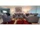 Bright living room with modern furniture, decorative pillows, and a stylish rug creating a cozy atmosphere at 4617 E Emile Zola Ave, Phoenix, AZ 85032