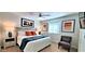Cozy main bedroom with stylish lamps and orange pillows at 4617 E Emile Zola Ave, Phoenix, AZ 85032