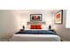 Cozy main bedroom with stylish lamps and orange pillows at 4617 E Emile Zola Ave, Phoenix, AZ 85032