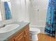Functional bathroom with vanity, toilet, and shower-tub combo at 50525 W Whirly Bird Rd, Maricopa, AZ 85139