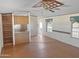 Open living room showcases a wood laminate floors and eat in bar at 50525 W Whirly Bird Rd, Maricopa, AZ 85139