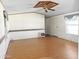 Spacious living room with wood laminate flooring and neutral wall color at 50525 W Whirly Bird Rd, Maricopa, AZ 85139