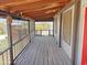Large covered porch with wood decking and views of yard at 50525 W Whirly Bird Rd, Maricopa, AZ 85139