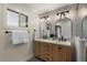 Modern bathroom features updated fixtures, a double vanity, and a bright window at 5332 N 81St Pl, Scottsdale, AZ 85250