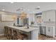 Bright and airy kitchen with stainless steel appliances, island seating, and pendant lighting at 5332 N 81St Pl, Scottsdale, AZ 85250