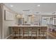 Bright kitchen featuring a large island with seating, stainless appliances, and modern lighting at 5332 N 81St Pl, Scottsdale, AZ 85250