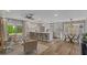 Open-concept kitchen with a large island, modern appliances, and seamless flow to the dining area at 5332 N 81St Pl, Scottsdale, AZ 85250