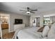 Spacious main bedroom with a view into the bathroom and backyard with mature trees at 5332 N 81St Pl, Scottsdale, AZ 85250