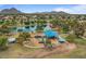 Scenic view of the community park that features a playground, lake, and green space at 5332 N 81St Pl, Scottsdale, AZ 85250