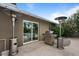 Backyard patio featuring outdoor grill and heater, with a glimpse of the inviting pool at 5332 N 81St Pl, Scottsdale, AZ 85250
