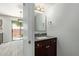 Stylish powder room boasts modern vanity and fixtures near the light and airy dining area and backyard access at 5704 E Aire Libre Ave # 1093, Scottsdale, AZ 85254